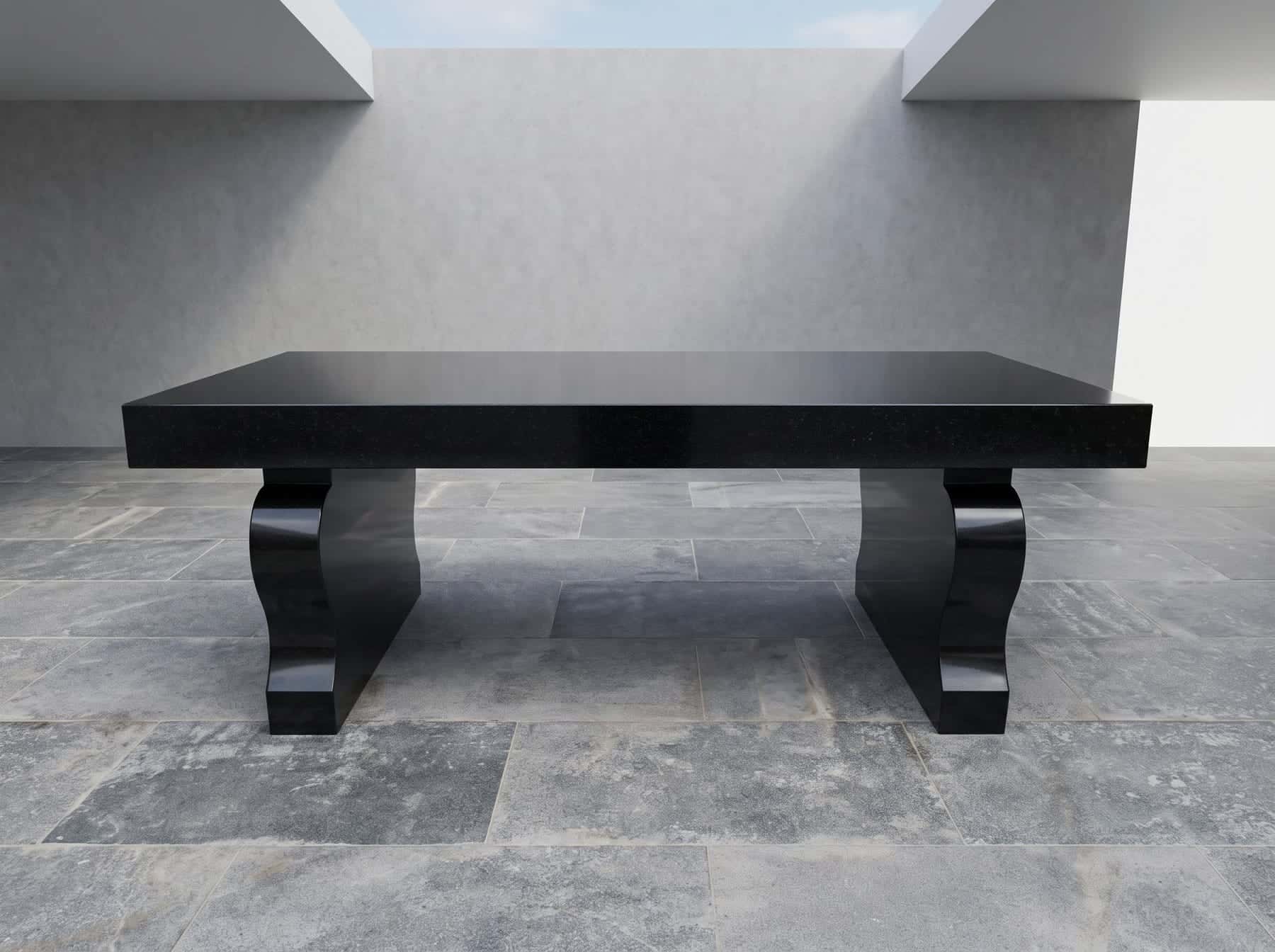 Polished black granite bench with curved legs against a pale wall