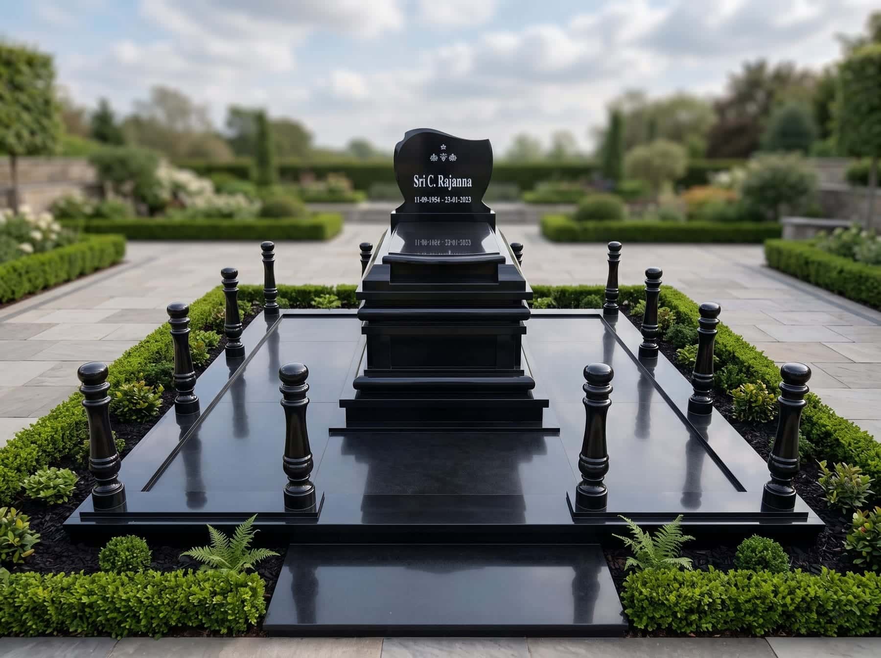 Black granite memorial with polished balusters surrounding a landscaped cemetery plot